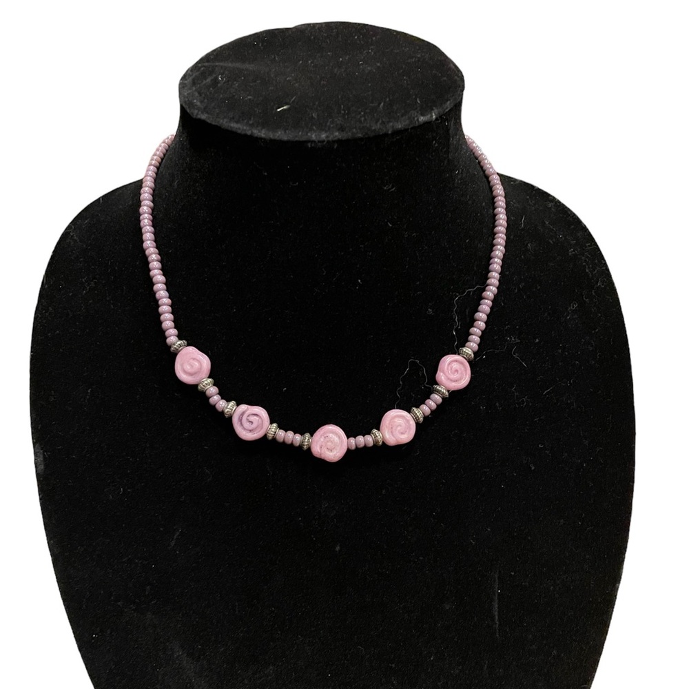 Purple iridescent beaded necklace with dusty pink swirl carved stones